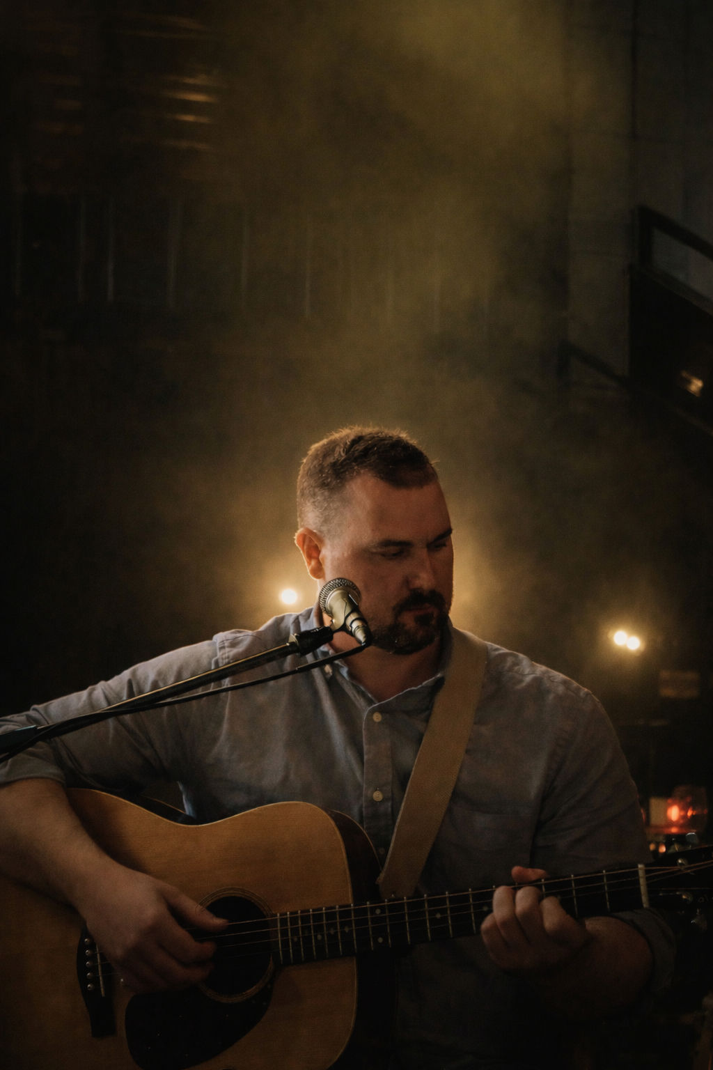 Zac Mason performing with acoustic guitar